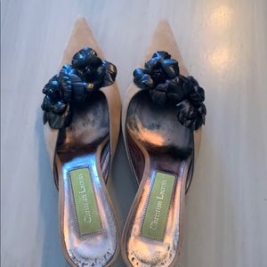 Flower detailed 2 1/2 inch heels.